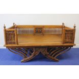 Asian hardwood howdah, possibly Siamese, with central carved panel flanked by spindles, raised on