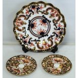 Royal Crown Derby plate with frilled rim decorated in the Imari palette, 23cm diam. and two small