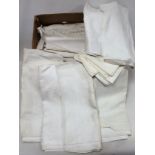 Box of linen including damask tablecloths and napkins.