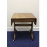Georgian style mahogany drop flap low table, the rounded rectangular ends raised on end supports and