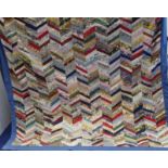 Mid to late 20th century patchwork bedspread with multiple chevroned stripes in multi coloured