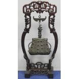 Chinese Qing dynasty cast bronze prayer bell of tapered lozenge form with twin salamander handles,