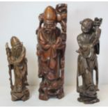 Two Chinese carved hardwood figures of the deity Shou Lao, the larger drilled as a lamp base, 39.5cm