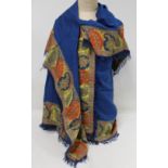 19th century English 'turnover' shawl, the blue wool field with applied polychrome woven borders of