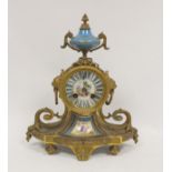 French Ormulu mantel clock with sevres style porcelain dial, a similar panel and vase finial and