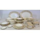 Wedgwood bone china "Gold Florentine" pattern dinner service, pattern no. W4219, for eight settings,