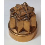 Benham & Froud masonic copper jelly mould of castellated circular form with square and compass motif