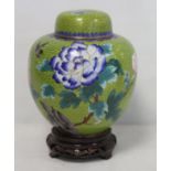 20th century Chinese cloisonné covered jar of ovoidform, decorated with a bird and peonies on lime