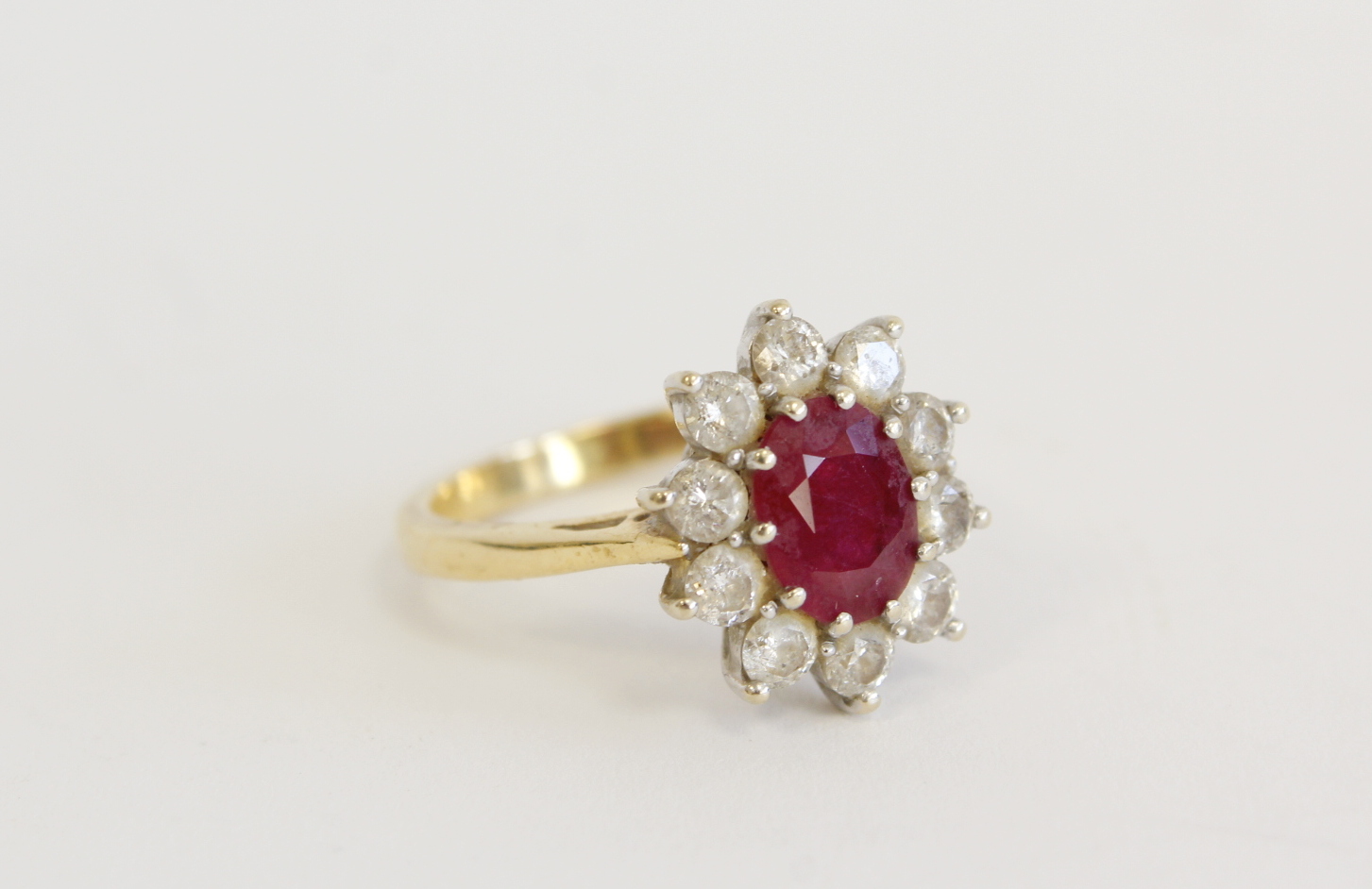 18ct gold cluster ring with oval ruby approx 1.5ct and diamonds Size N