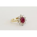 18ct gold cluster ring with oval ruby approx 1.5ct and diamonds Size N