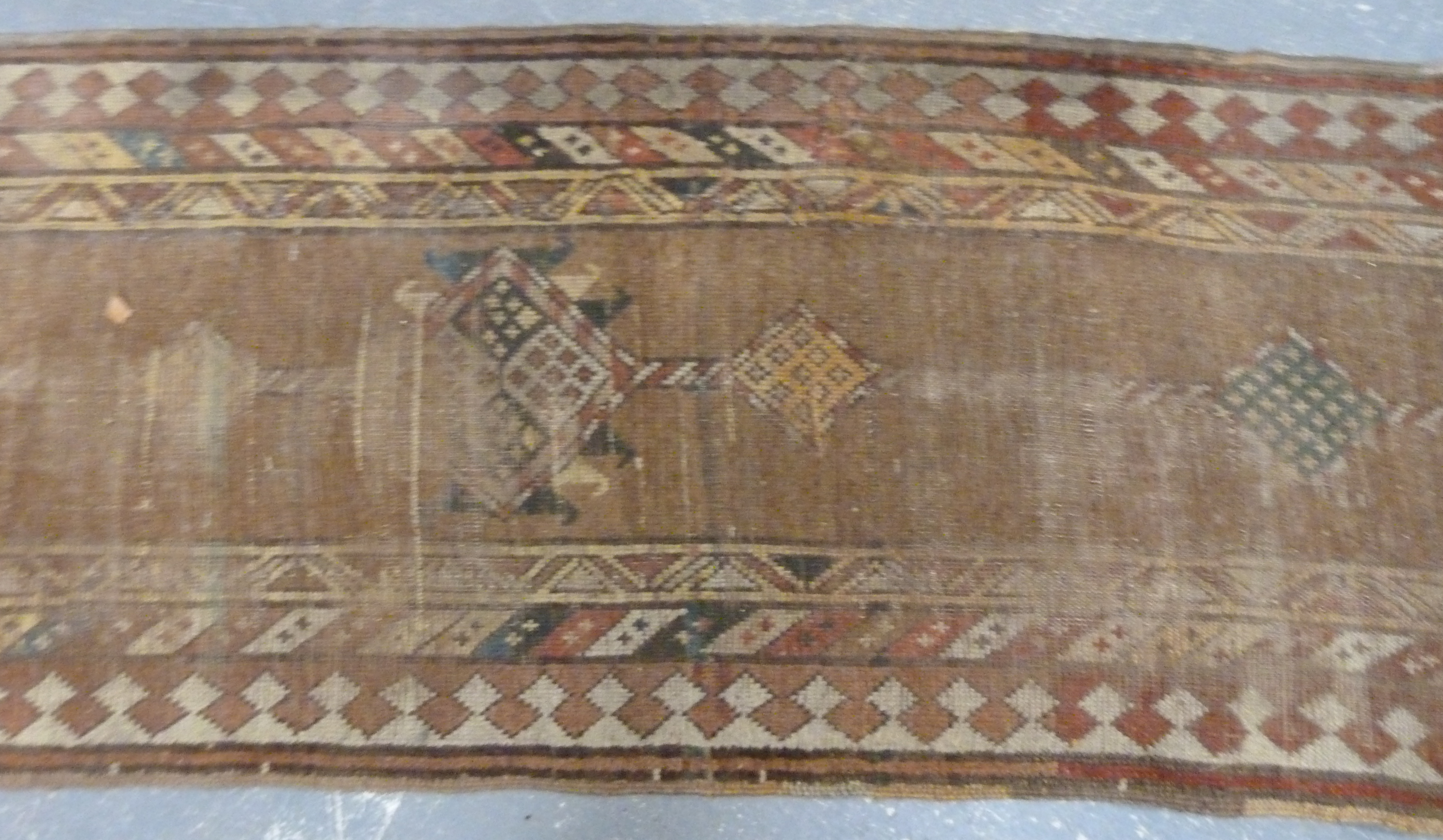 Turkish wool runner with geometric medallions and borders in muted palette, 285cm x 83cm, well worn. - Image 3 of 4