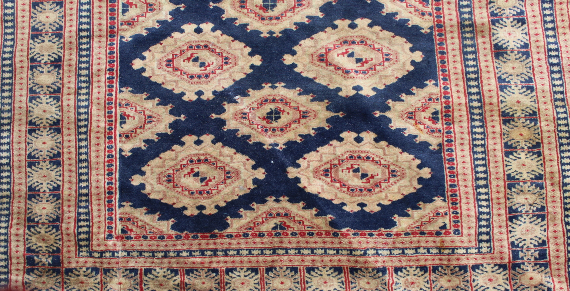 Eastern wool rug with multiple hooked octagonal medallions on blue field, 201cm x 124cm. - Image 3 of 12