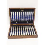 Set of twelve engraved silver fruit knives and twelve forks with pearl handles, by Walker & Hall,