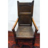 Antique oak country made carver chair with panel back and solid seat