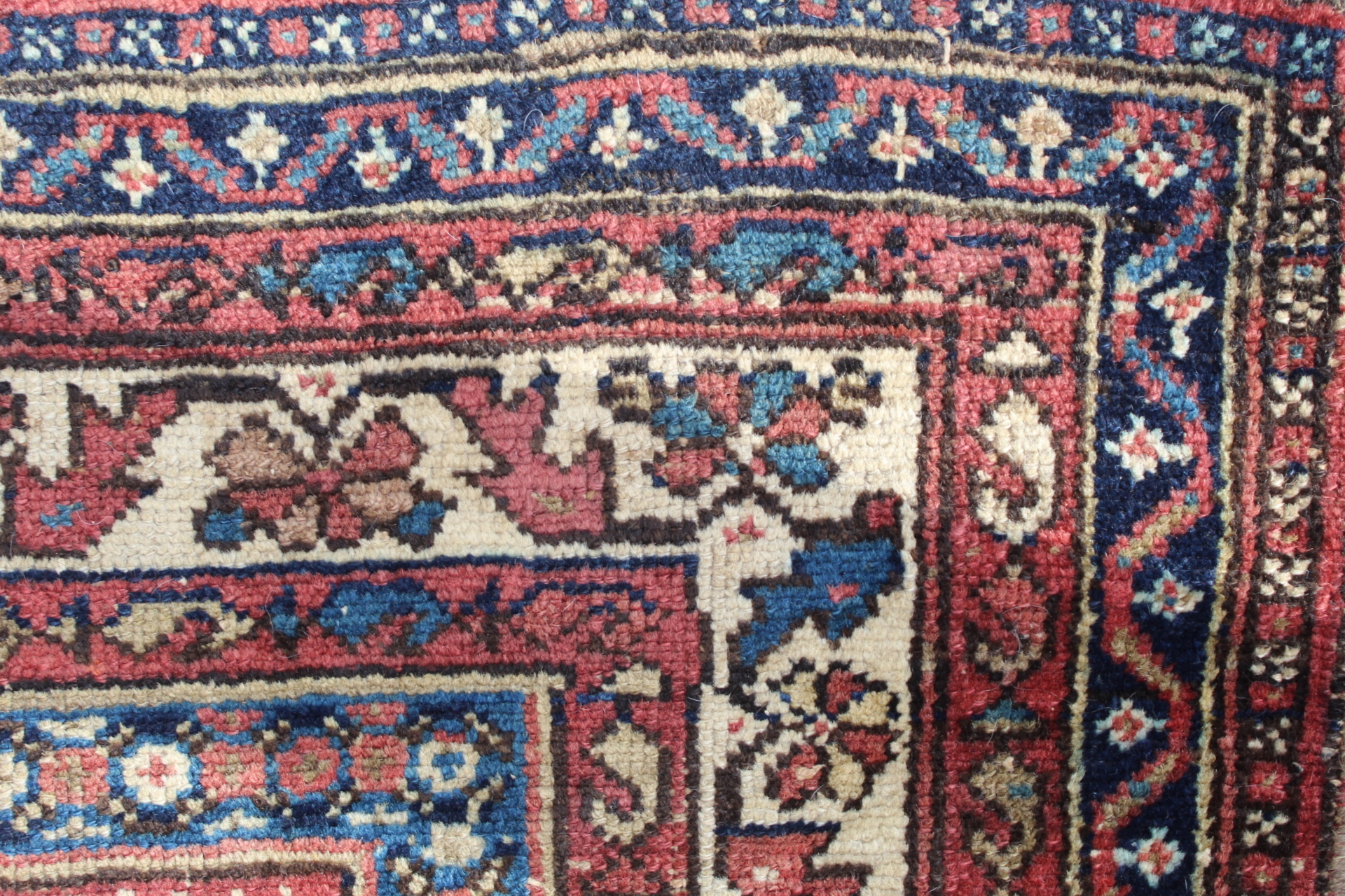 Persian wool rug in red, blue and cream with multiple boteh to main field , 199cm x 130cm. Old - Image 6 of 9
