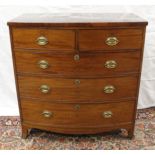 Early 19th century mahogany bow fronted chest of two short & three long drawers raised on bracket