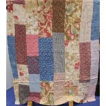 Victorian pieced rectangular block patchwork quilt in various polychrome printed cottons with square