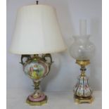 Two Continental porcelain and gilt metal table lamps, 63cm and 51cm high. Electrical testing and