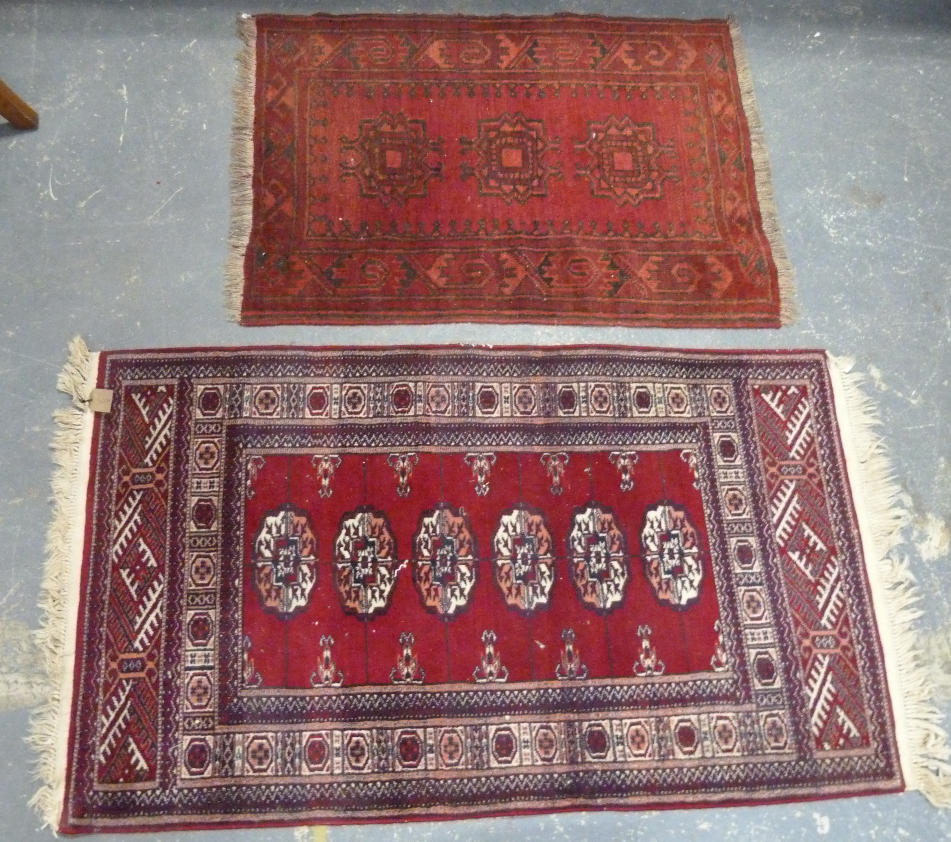 Two small Persian rugs, 130cm x 72cm and 95cm x 64cm.