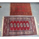 Two small Persian rugs, 130cm x 72cm and 95cm x 64cm.