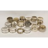 Eighteen silver napkin rings various, 482g.