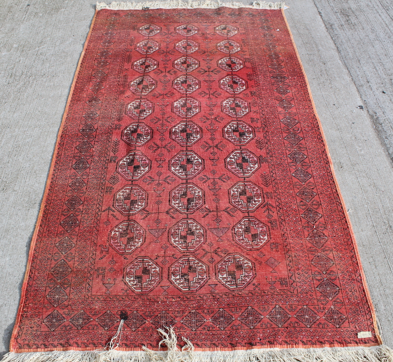 Persian silk on cotton rug, the teracotta field with three rows of octagonal guls, 208cm x 116cm. - Image 5 of 10