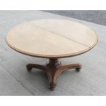 19th century mahogany oval breakfast table raised on carved column and quadrepartite base, 160cm