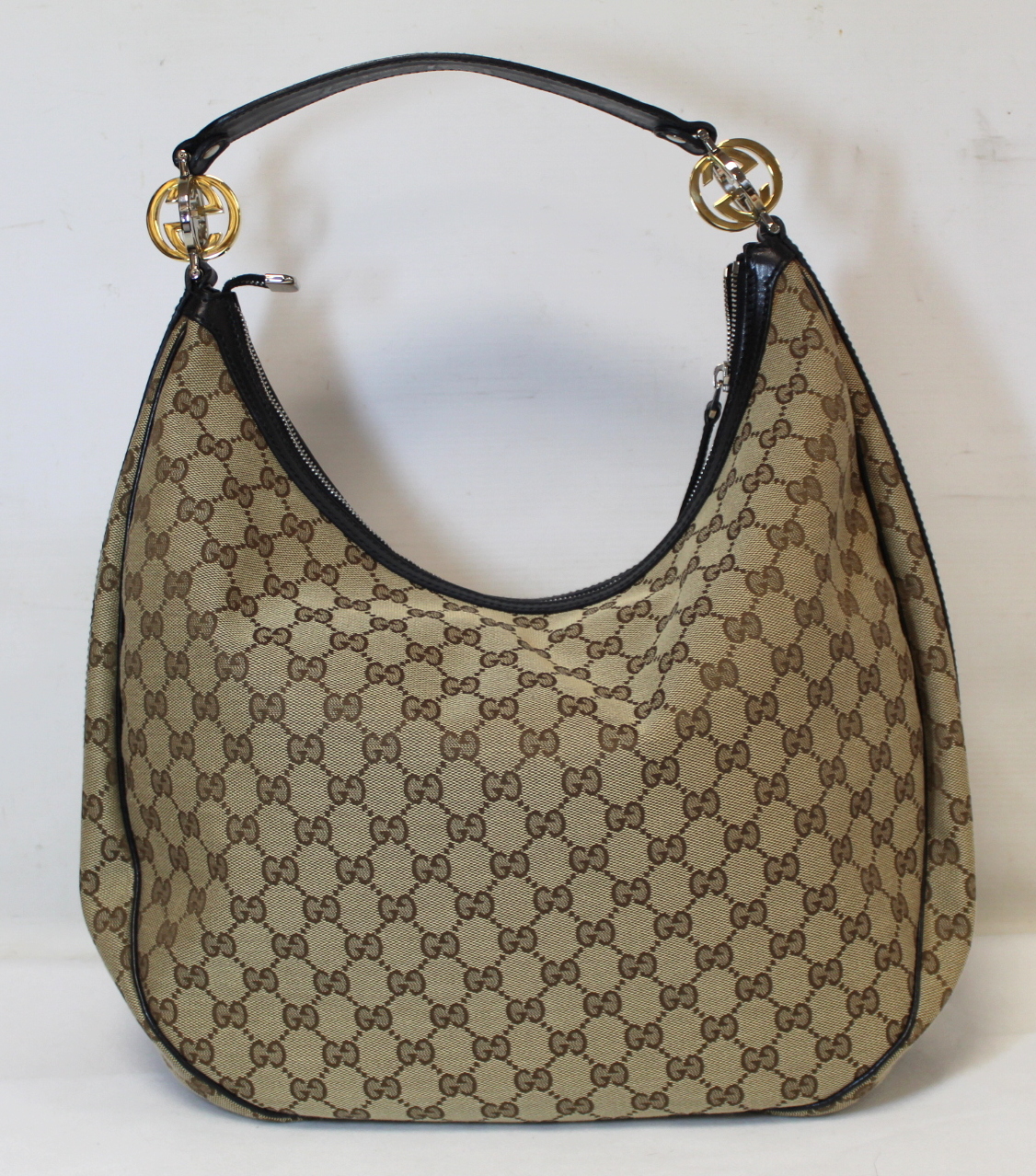 Gucci "Hobo" lady's handbag in beige and brown GG canvas with leather trim and handle and gold toned