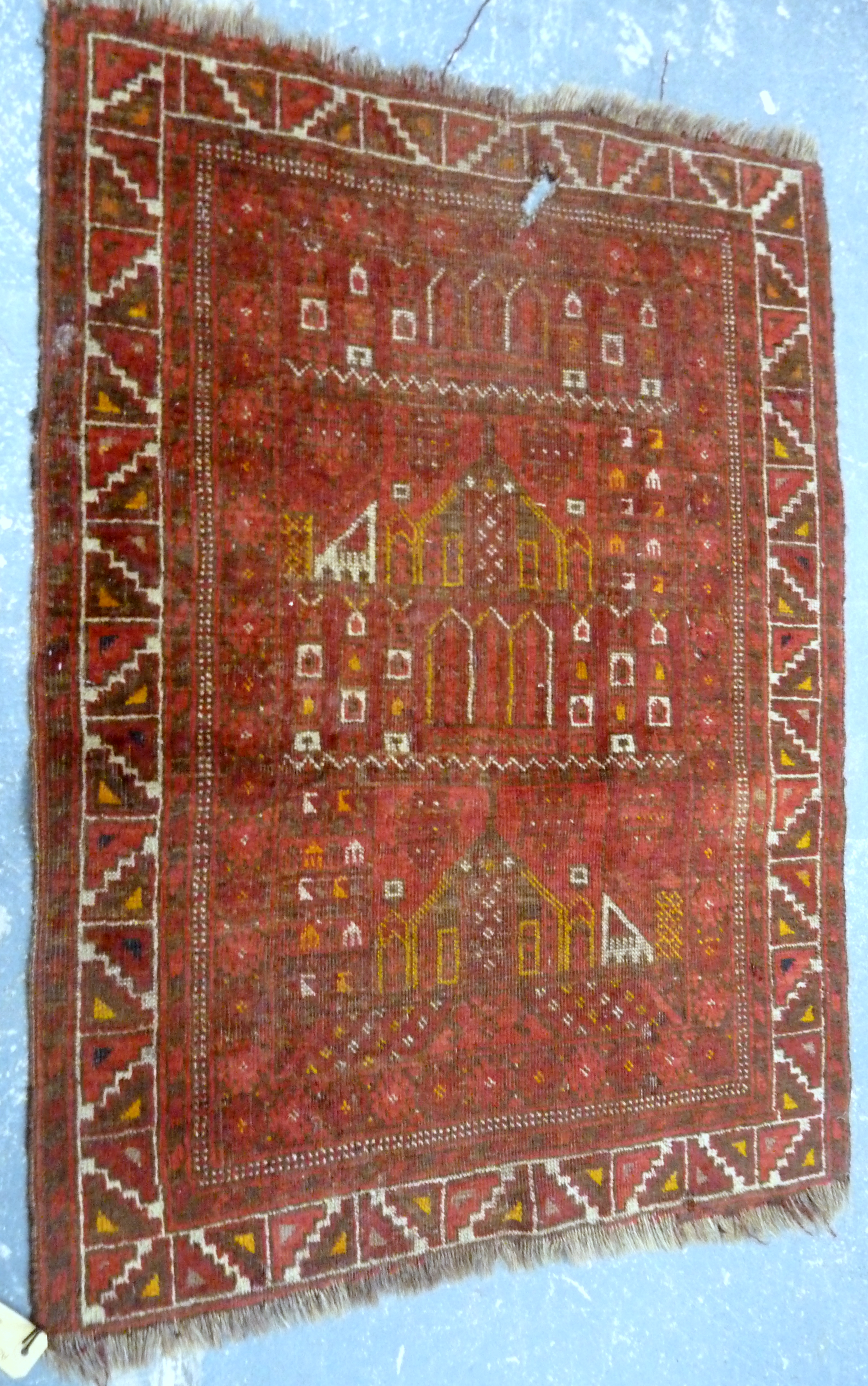 Persian wool prayer mat, the central field depicting buildings, 105cm x 75cm.