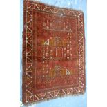 Persian wool prayer mat, the central field depicting buildings, 105cm x 75cm.