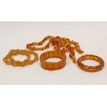 Amber bead necklace, 66g and three similar items.