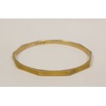 9ct gold slave bangle, engraved ten sided by Mappin & Webb, 1924.