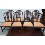 Set of eight Hepplewhite style mahogany dining chairs, slip in seats on square tapered supports,