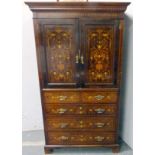 Inlaid mahogany linen press, c. 1890/1900, enclosed by pair of panel doors with winged head, crowns,