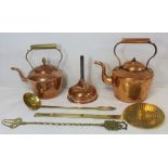 Two copper kettles, 30cm high and 26.5cm high; a copper funnel, 22cm high and 16cm diam.; a brass