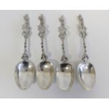Set of four Dutch 19th century silver spoons with 'fantasy' marks and cast openwork stems. 9 1/2oz.