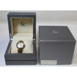 G. C. Guess Collection two-eye day/date lady's wristwatch with mother of pearl dial, snakeskin