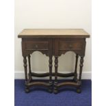 Antique early 18th century style side table the fold over top over two drawers raised on turned