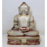 19th or early 20th century Indian alabaster figure of Buddha in meditation seated on a triangular