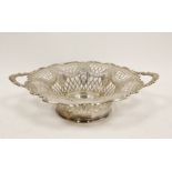 Silver circular two handled bowl, pierced and embossed with swags, Sheffield 1905, 13oz / 406g.