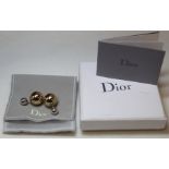 Pair of Dior 'Tribales' gold and silver resin earrings. With jewellery pouch and box.