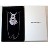 Balenciaga large crystal brooch of entwined form with white metal chain for conversion to