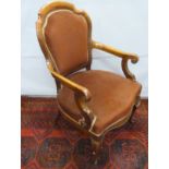 Victorian mahogany framed lady's chair with carved scroll arms raised on cabriole supports