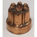Benham & Froud antique copper jelly mould of circular turreted form no. 481, 12.5cm diam., with