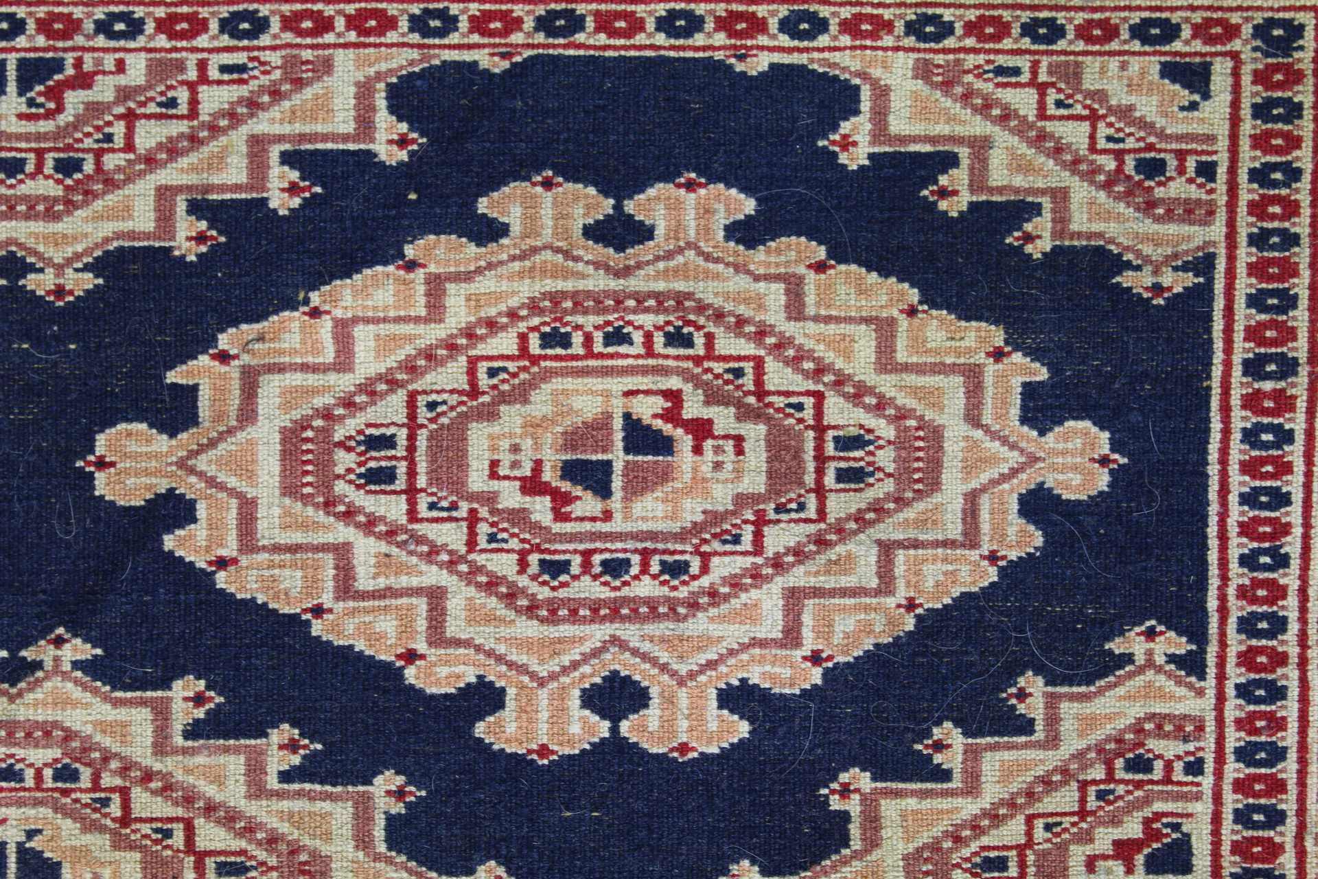 Eastern wool rug with multiple hooked octagonal medallions on blue field, 201cm x 124cm. - Image 11 of 12