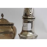 Silver tea caddy of bulbous rectangular form, hinged lid engraved MCC Chester 1901 also a Georgian