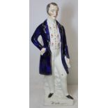 Victorian Staffordshire pottery figure of The Duke of Wellington in civilian dress decorated in