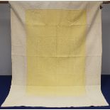 1930's framed two tone reversible pale yellow and white quilted bedspread with central flowerhead in