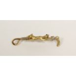 Gold riding crop and fox brooch, 14k. 6g.