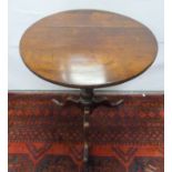 Antique oak tilt top tripod table raised on baluster column. 64cm